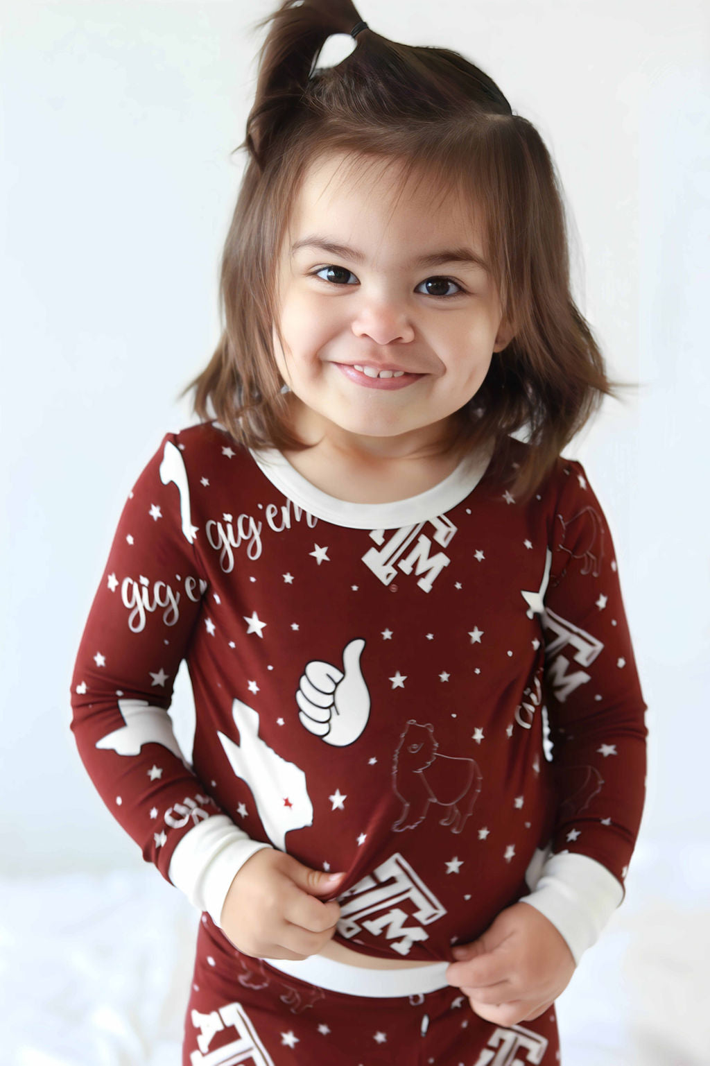 Toddler standing wearing Texas A&M two piece pajama