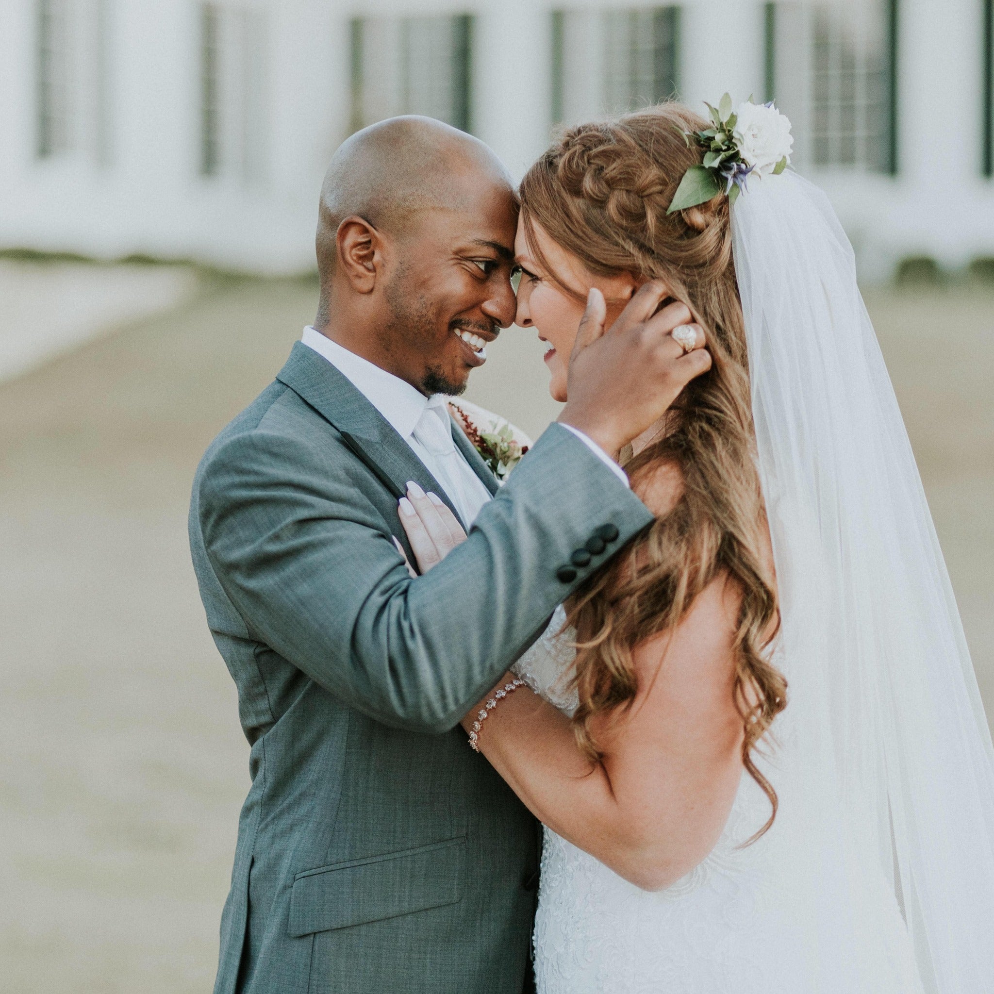 Joe holding on to Laura face at their wedding in 2019 