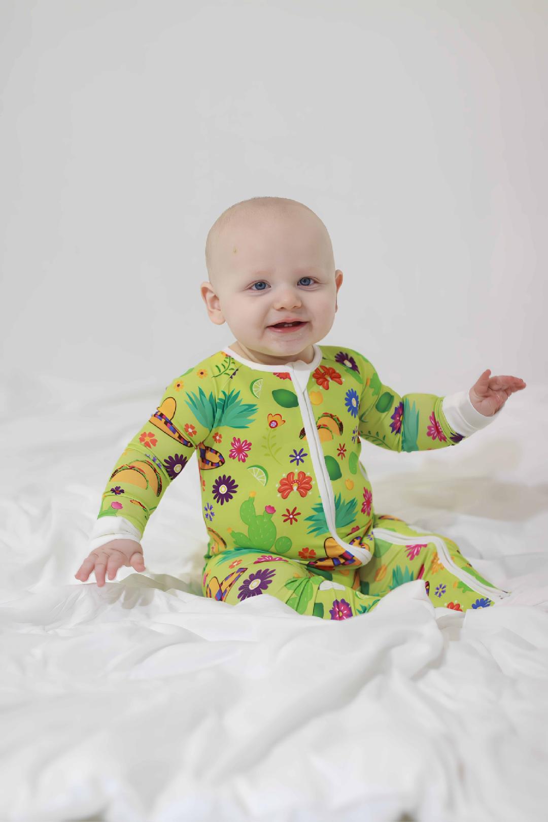 Lime green fun playful green sleeper design with baby sitting and laughing